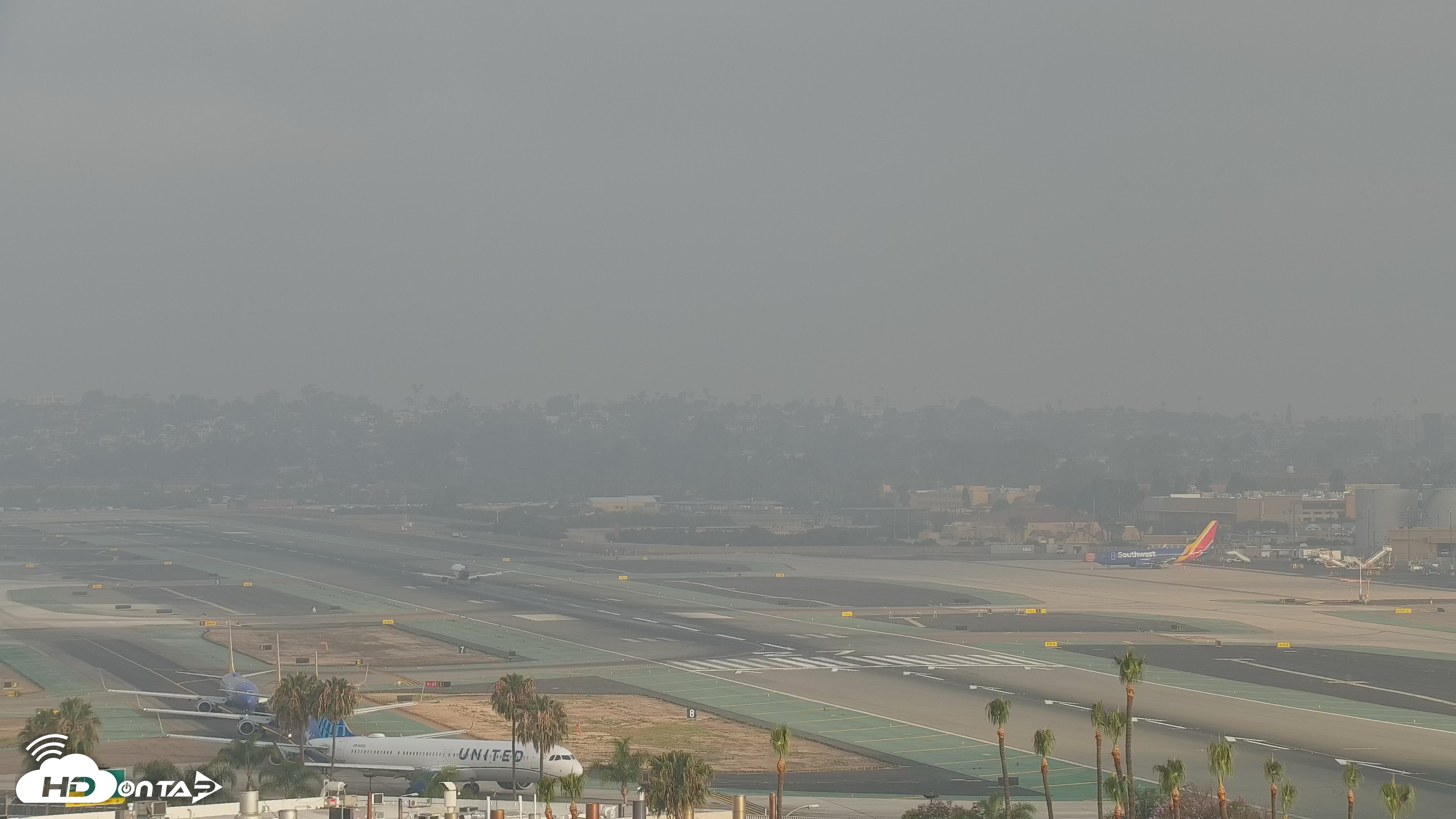 Snapshot of SD Lindbergh Airport & Bay Live Webcam taken May 20, 2026, 7:00am PDT
