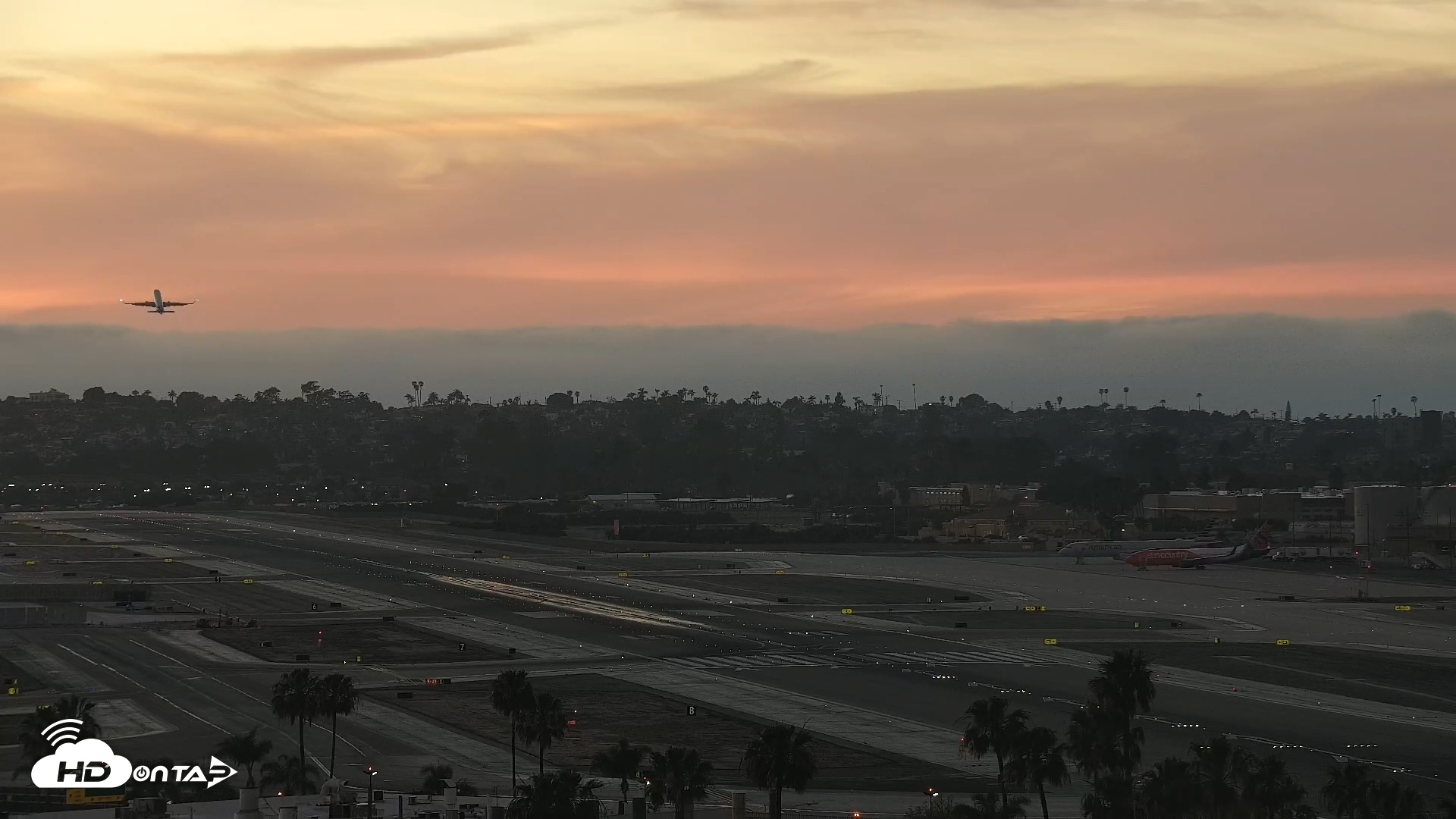 Snapshot of SD Lindbergh Airport & Bay Live Webcam taken Mar 21, 2026, 7:11pm PDT