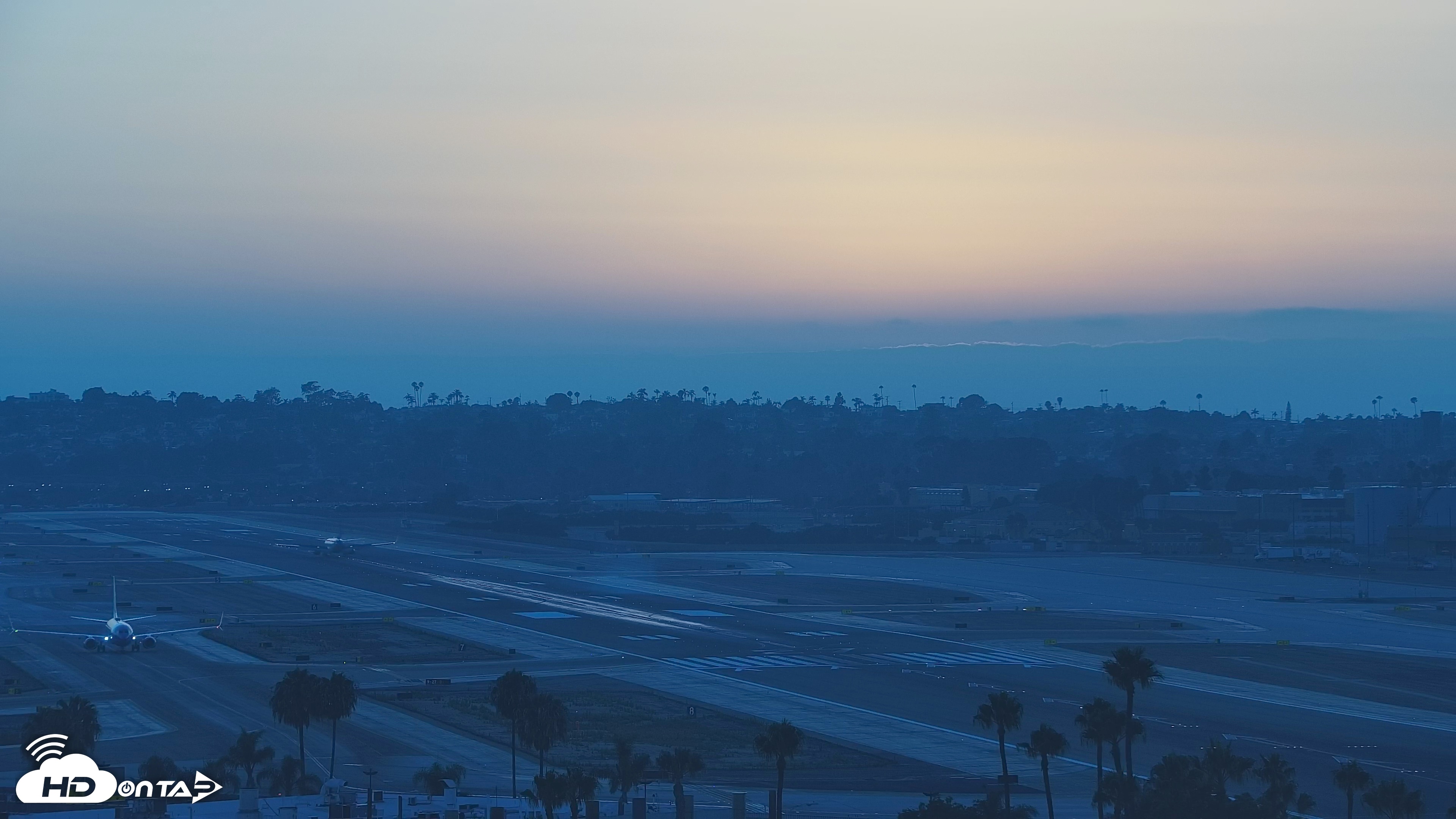 Snapshot of SD Lindbergh Airport & Bay Live Webcam taken Jul 19, 2026, 7:54pm PDT