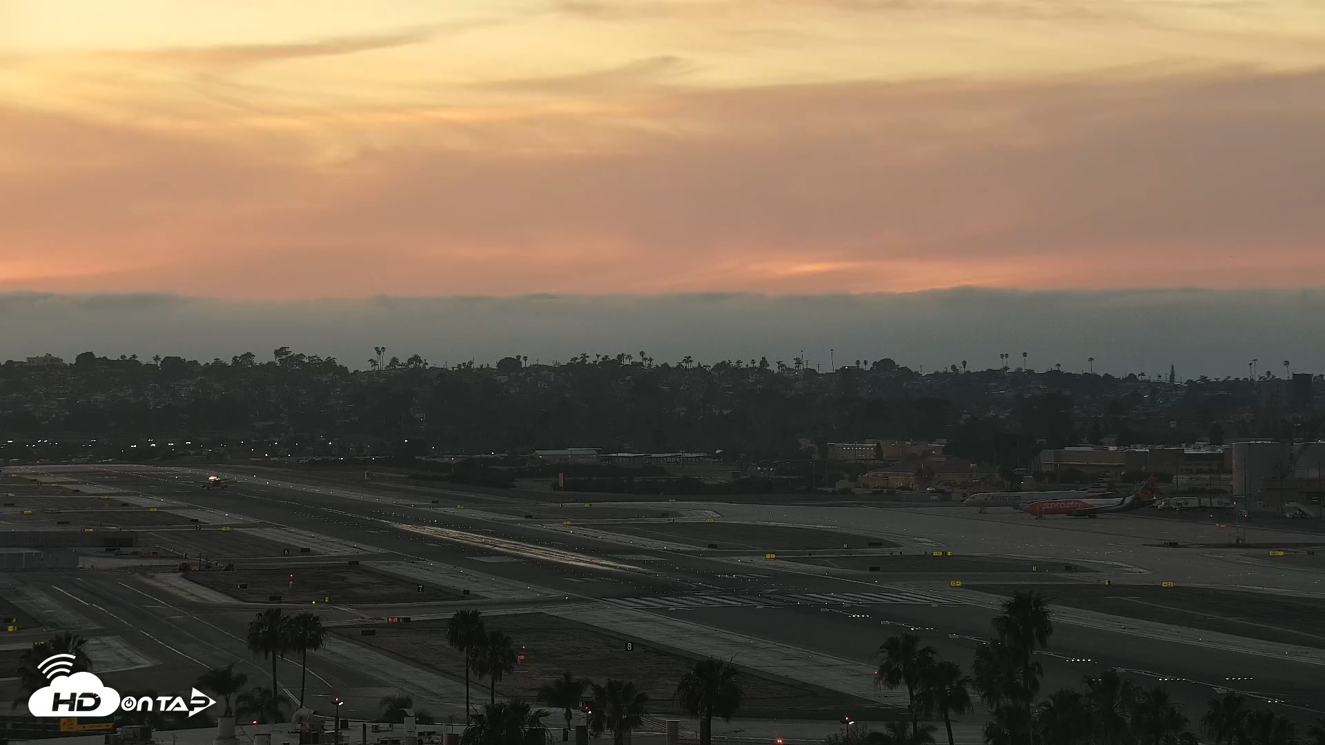 Snapshot of SD Lindbergh Airport & Bay Live Webcam taken Mar 21, 2026, 7:09pm PDT