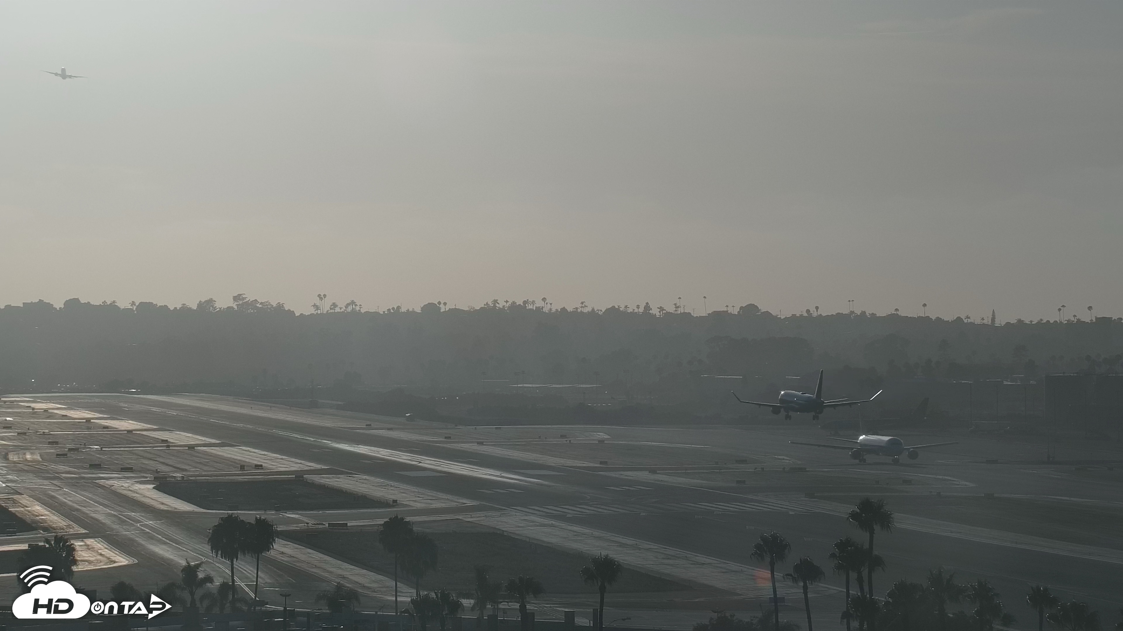 Snapshot of SD Lindbergh Airport & Bay Live Webcam taken Jul 24, 2026, 7:09pm PDT