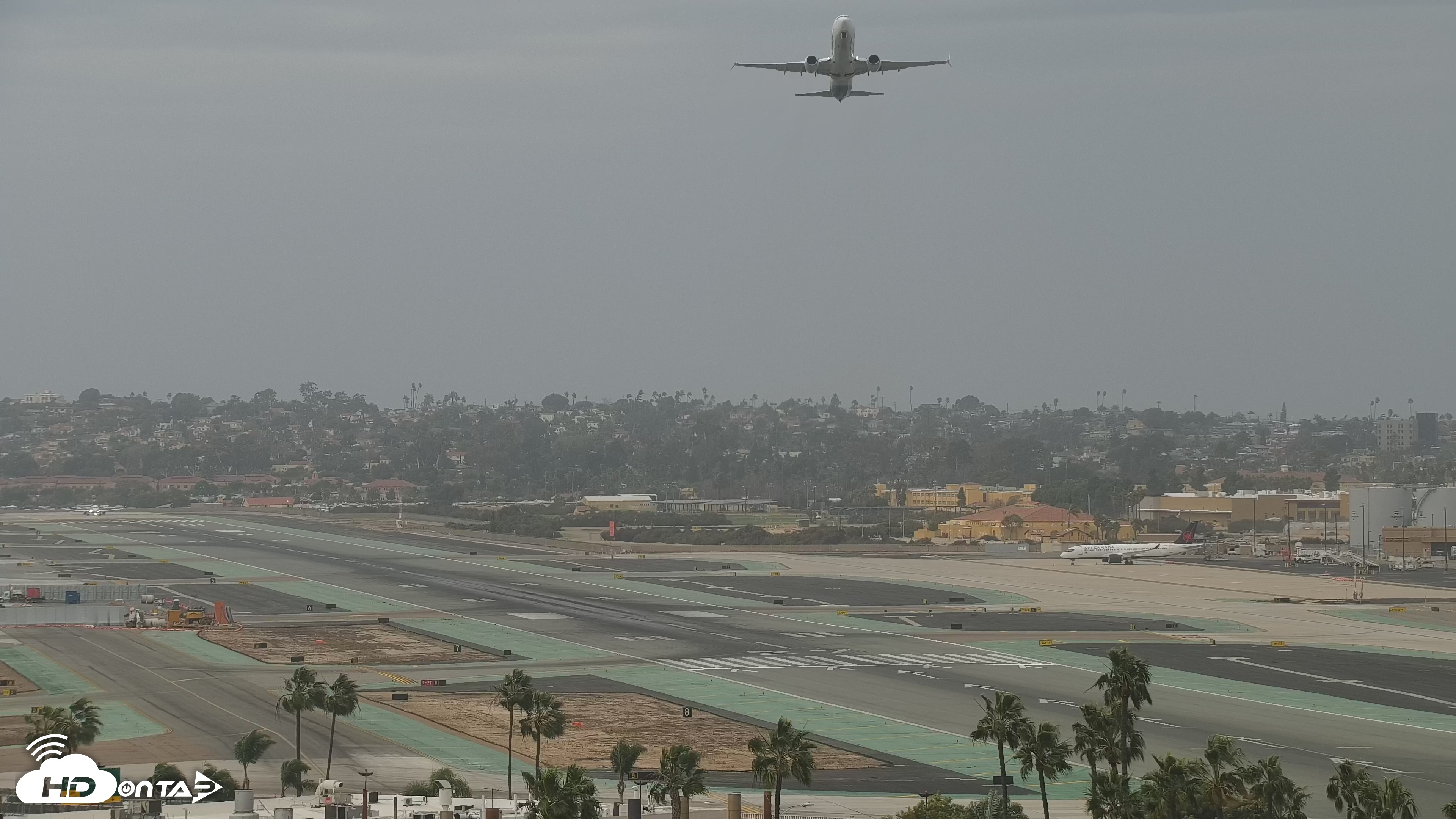 Snapshot of SD Lindbergh Airport & Bay Live Webcam taken Dec 24, 2025, 12:30pm PST