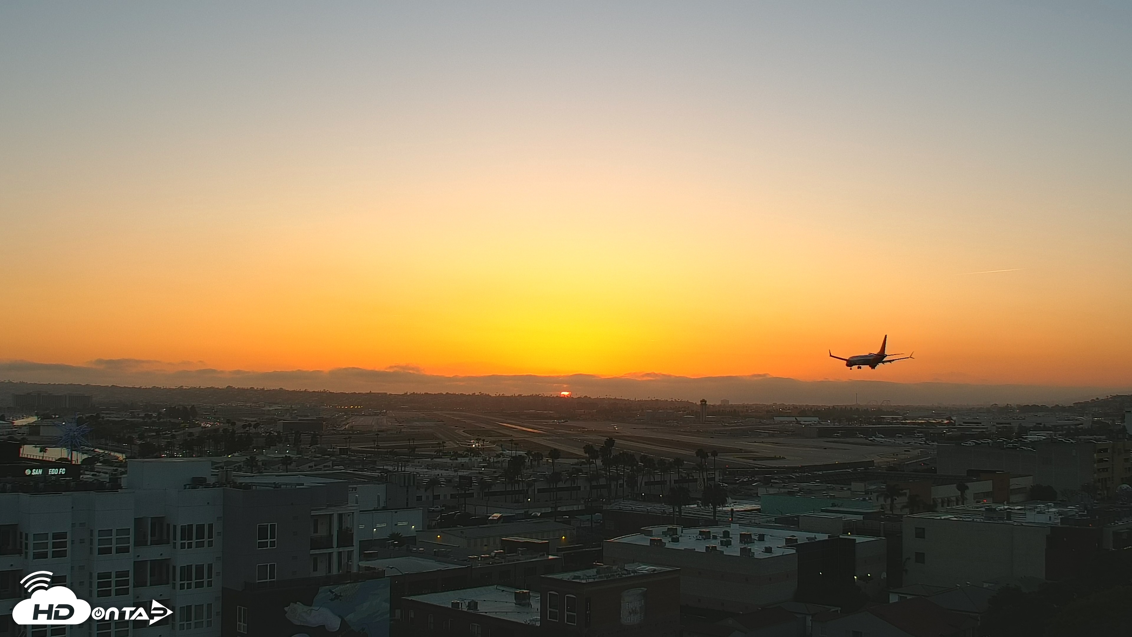 Snapshot of SD Lindbergh Airport & Bay Live Webcam taken May 21, 2025, 7:43pm PDT