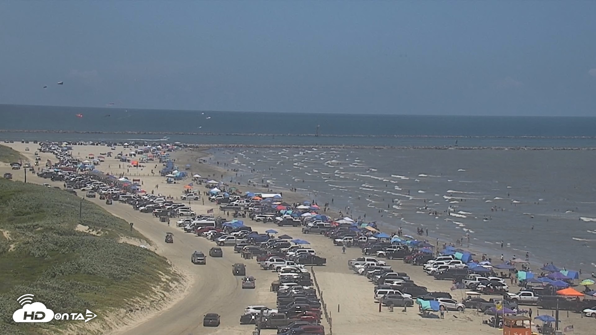 Snapshot of The Dunes - Port Aransas Live Beach Cam taken Jul 4, 2026, 2:24pm CDT