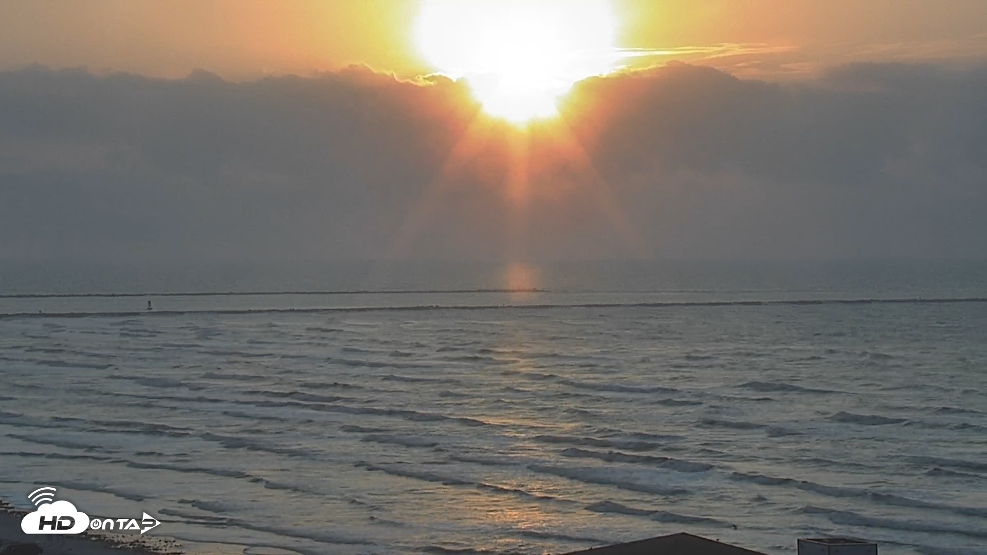 Snapshot of The Dunes - Port Aransas Live Beach Cam taken May 18, 2025, 6:57am CDT