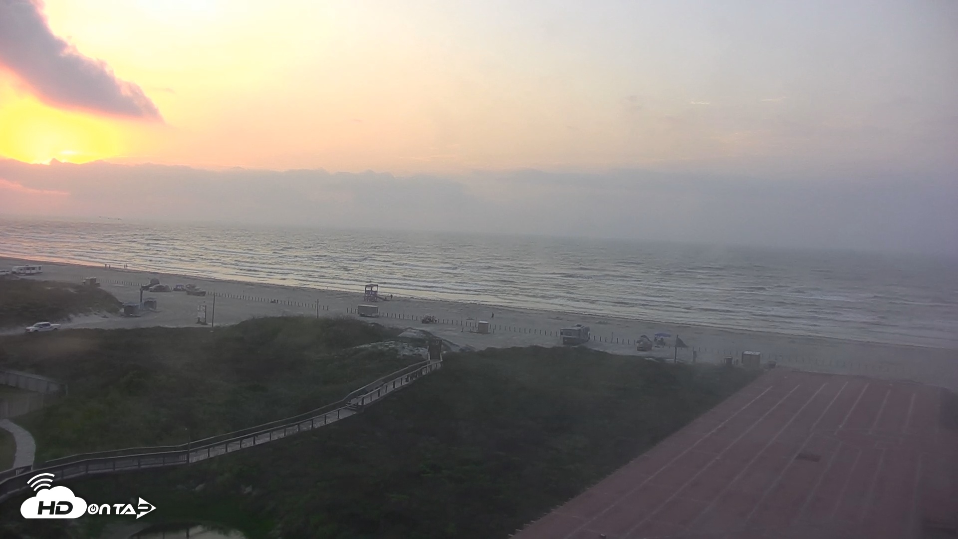 Snapshot of Sandcastle Condos Port Aransas Live Beach Cam taken May 18, 2025, 6:54am CDT