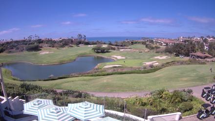 Golf fairway and ocean beyond at Monarch Beach Golf Links with coastal greens and blue sky