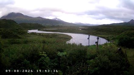 Wide weather view of Frazer Lake and Dog Salmon River on Kodiak Island in Alaska with changing skies!