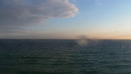 View over the Gulf from the Rod & Reel Pier area with water, sky, and distant shoreline at Anna Maria Island