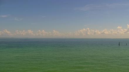 PTZ view of Anna Maria Island shoreline and the Rod and Reel Pier with boats and open water near the north end of the island.