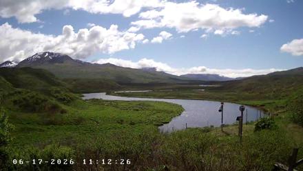 Wide weather view of Frazer Lake and Dog Salmon River on Kodiak Island in Alaska with changing skies!