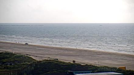 Waves rolling onto the sandy shoreline in front of the Aransas Princess beachfront complex