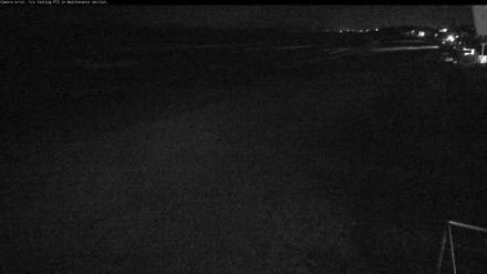 Wide view of Del Mar Beach South with waves rolling onto the sand under coastal skies