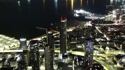 Southeast view from Salesforce Tower over South Beach Harbor and San Francisco Bay, with marinas, ships, and the city skyline.